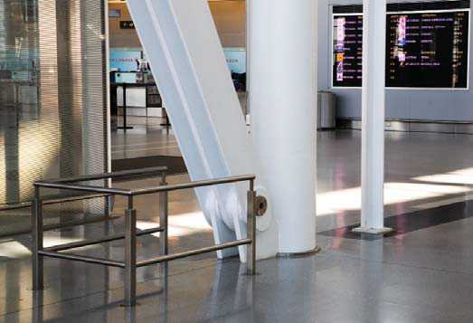 Metal railing below slanted support beam.